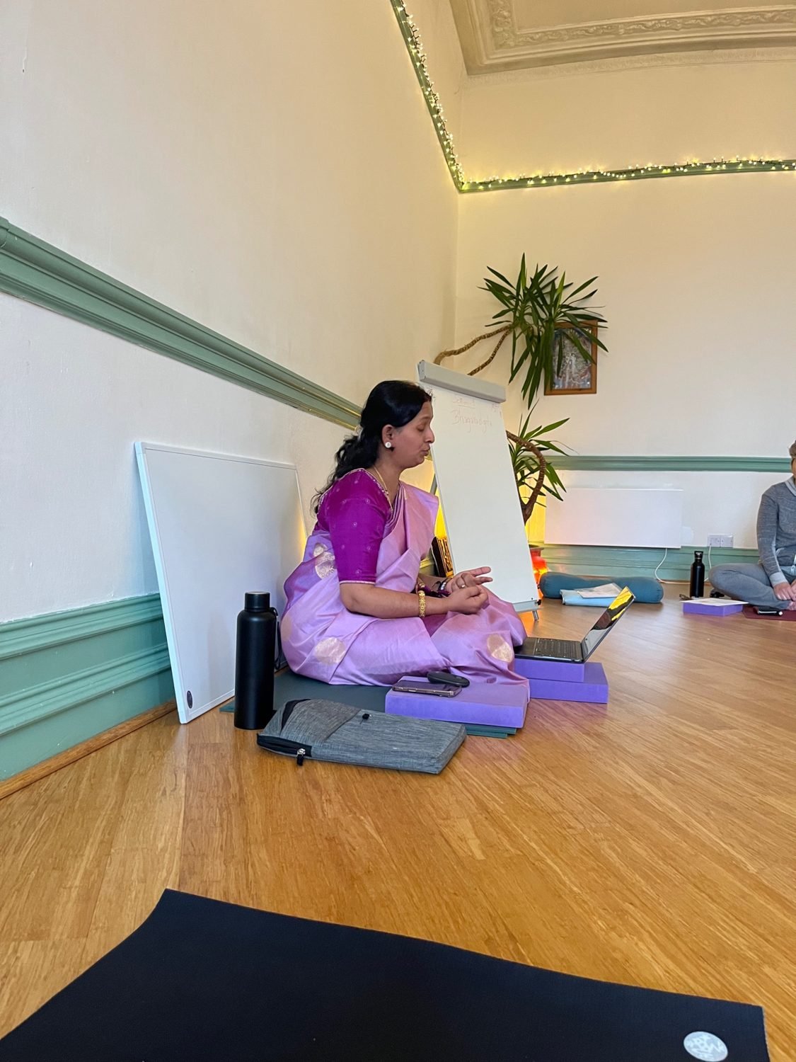 Yogashree teaching a small group